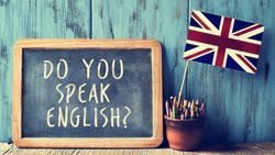 'Do you speak English?' sign sits next to a miniature Union Jack 