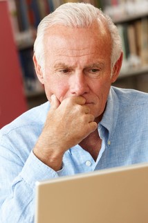 Pensive academic scholar engages in research online 