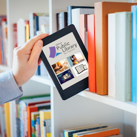 Academic places an e-book on library shelf in between traditional books