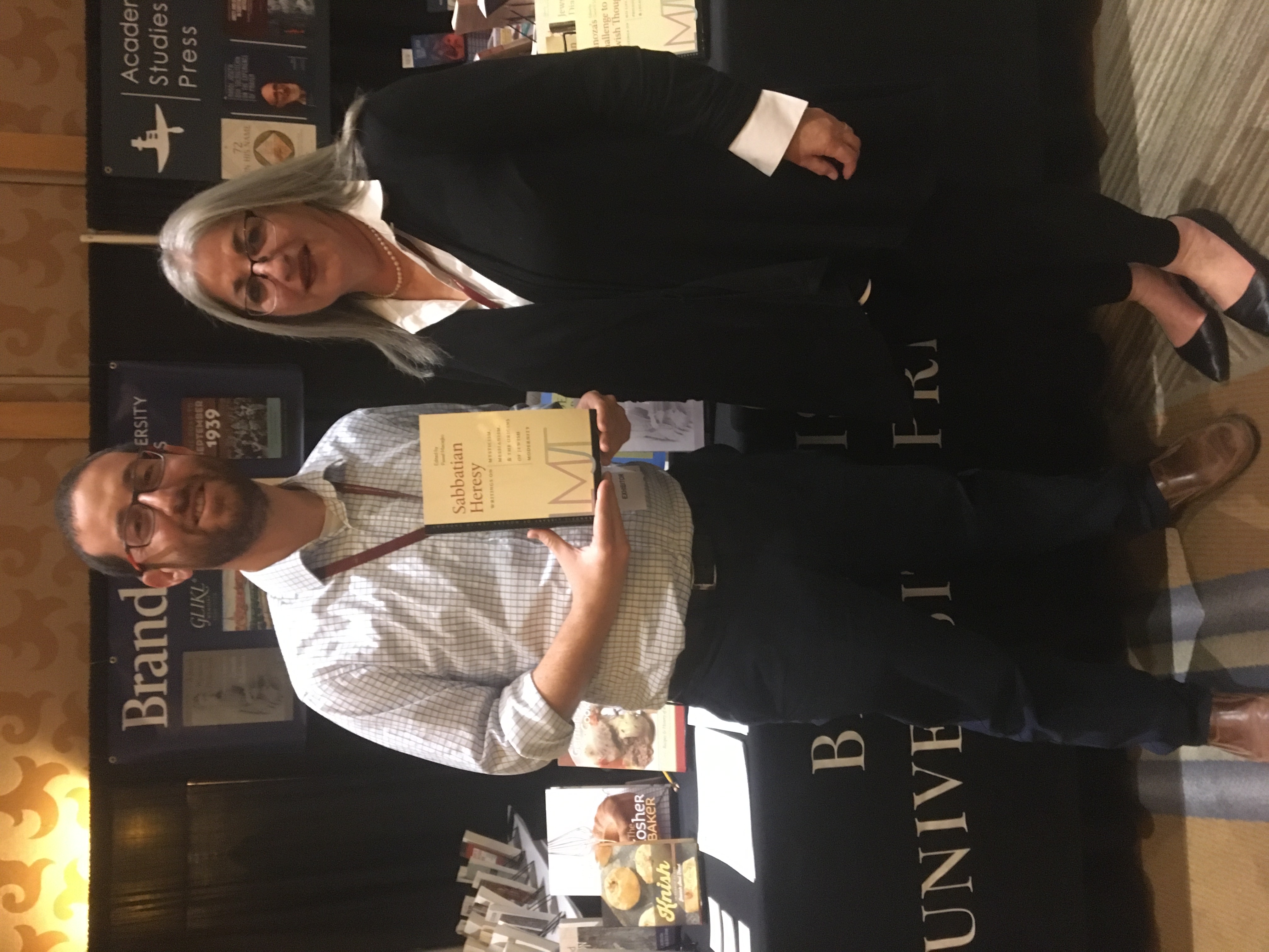 Female academic in the presence of numerous academic books
