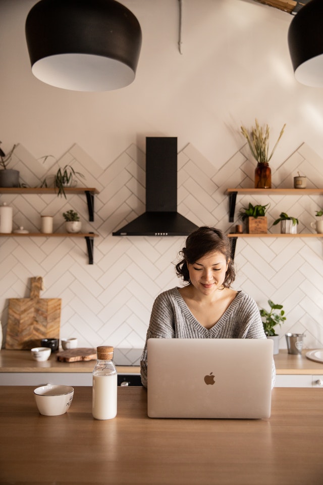 Female academic conducts research online