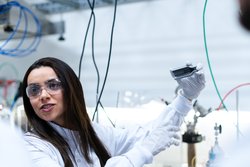 Female scientist conducts experiment in laboratory